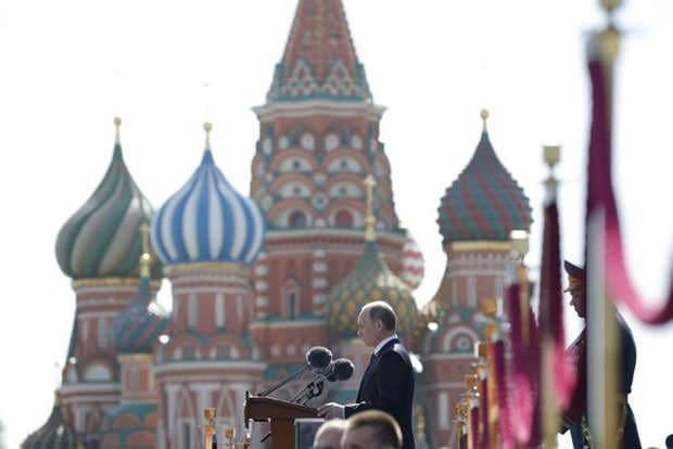 Russian President Vladimir Putin addresses the Victory Parade marking the 70th anniversary of the defeat of the Nazis in World War II, in Red Square, Moscow, Russia, Saturday, May 9, 2015. (AP Photo/Alexander Zemlianichenko, Pool)